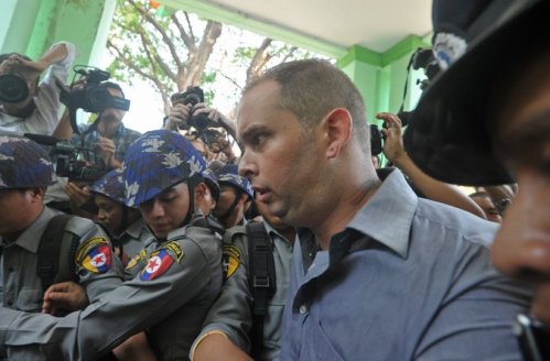 Philip Blackwood, a bar manager from New Zealand, leaving court on Tuesday. Mr. Blackwood and two Burmese men were sentenced to two years in prison in Myanmar for posting an image online of the Buddha wearing headphones to promote an event. Credit Soe Than Win/Agence France-Presse — Getty Images 